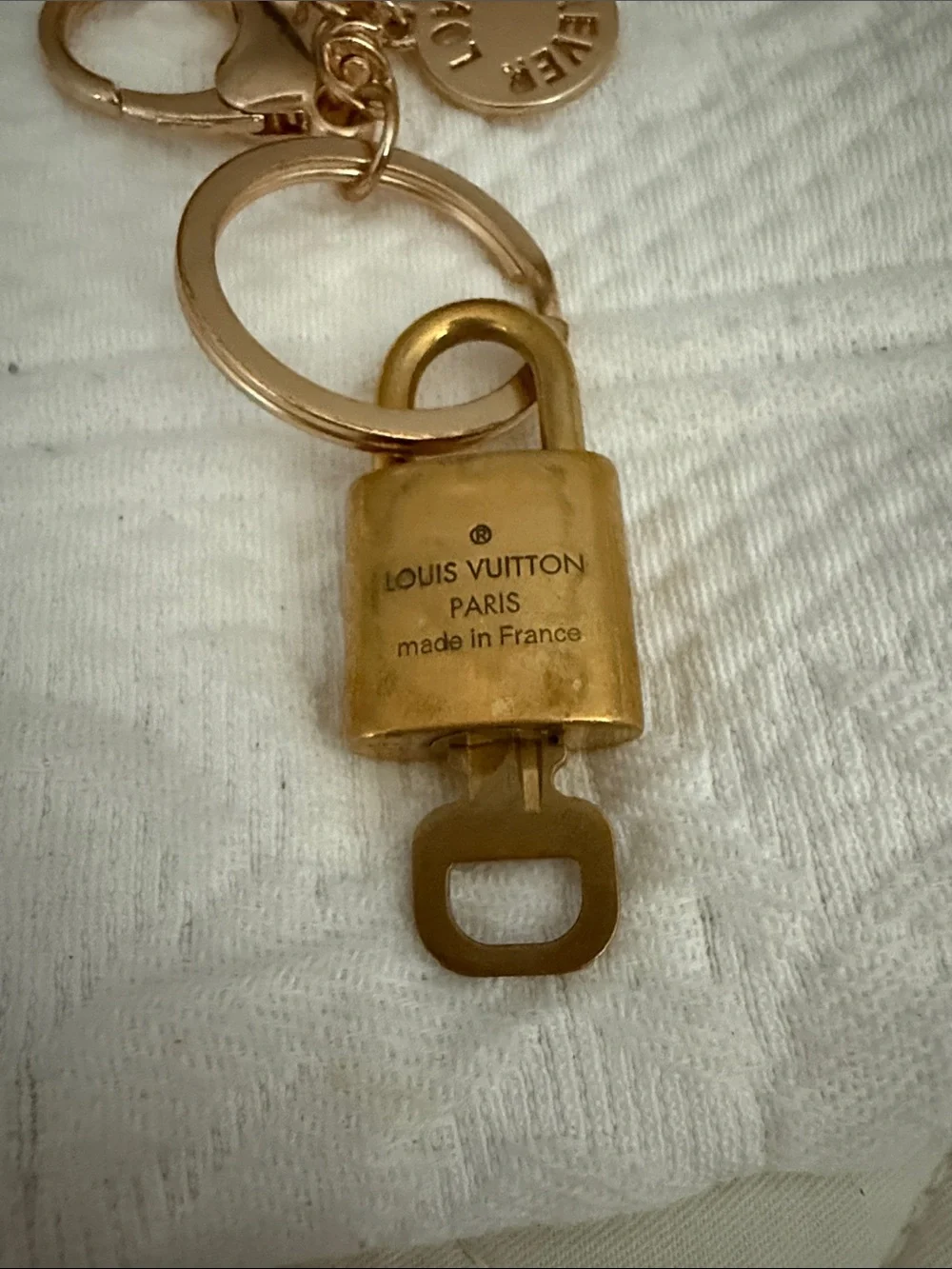 LV lock and key on an unbranded key ring or bag charm